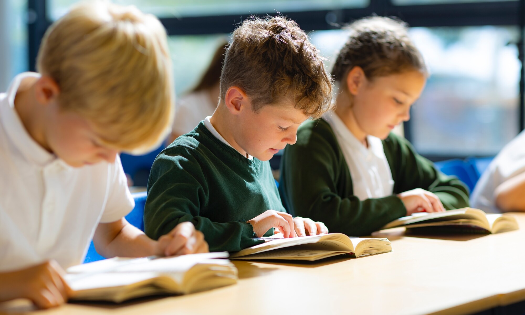 Telscombe Cliffs Academy Image of three Pupils in the Classroom